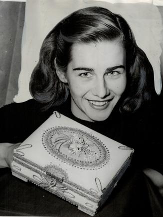 Thelma Moyer holds gift, The box is about six by eight inches and about three inches deep