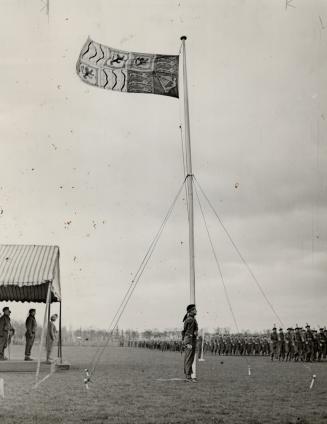 At right, the royal standard flying during the inspection by her majesty