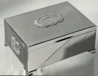 Replica of gold tea casket given King and Queen, One of 35 chromium replicas of a solid gold casket presented to the King and Queen 