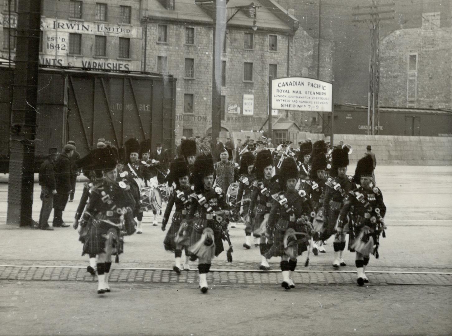 Coronation bound, Marching smarly to shed number 9 in Montreal, where they embarked aboard the Canadian Pacific Liner Montcalm for England, Canada's C(...)