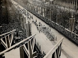 The millions who came to cheer Geroge VI at his coronation today lined the streets in sad, but no less certain manner