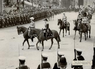 Henry, Duke of Gloucester and George, Duke of Kent, brothers of the King, riding in the procession en route to Westminister Abbey. [Incomplete]