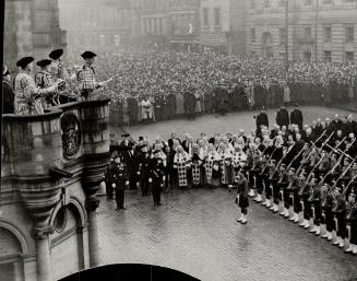 With pomp and pageantry Sir Francis Grant, Lord Lyon King of Arms, reads the proclamation declaring George VI king at Mercat Cross, Edinburgh