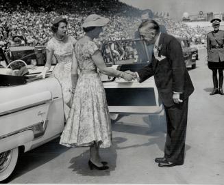 Robert Saunders, president of the CNE, greets the Duchess of Kent as the royal visitors arrive at the grandstand, where the Duchess took the Warriors'(...)
