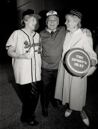 From left to right, Meredith Saunderson in baseball shirt and hat, Eddie (Fast Eddie) Goodman, ROM chairman of the board, and Mary Chamberlain