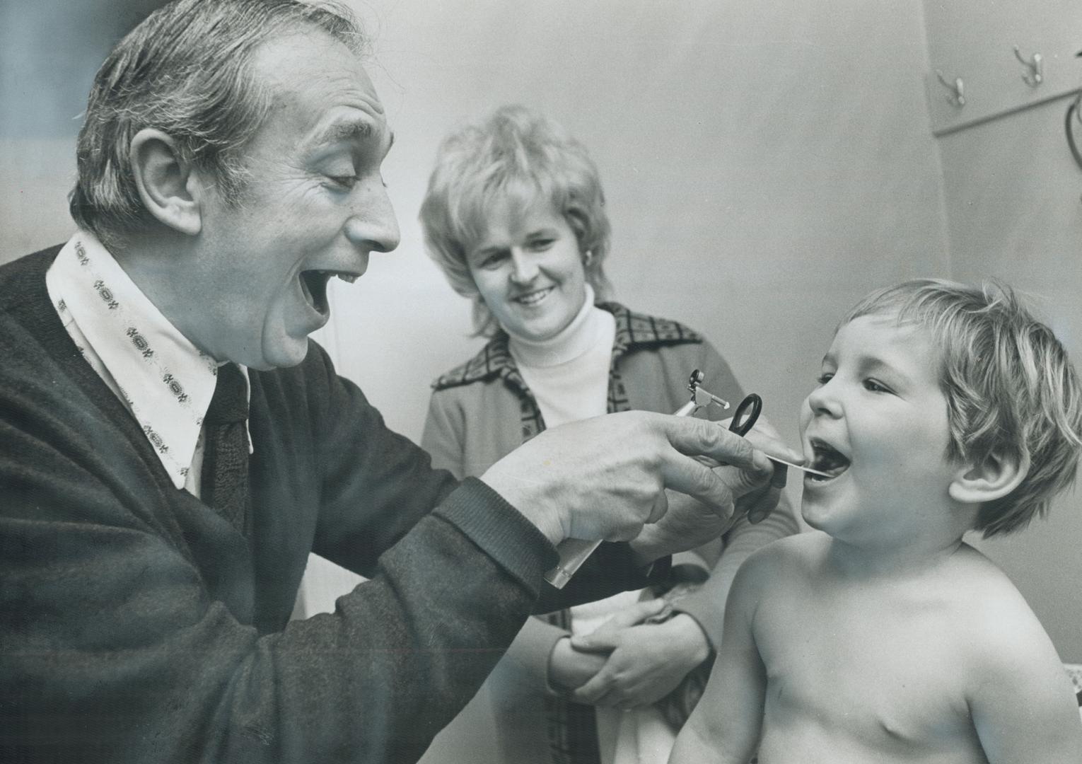 It's smiles all around as Dr. Joe Greenberg examines Sean Finn while Sean's mother, Mrs. Ron. Finn of Brampton, looks on. Key to his practice, the doc(...)