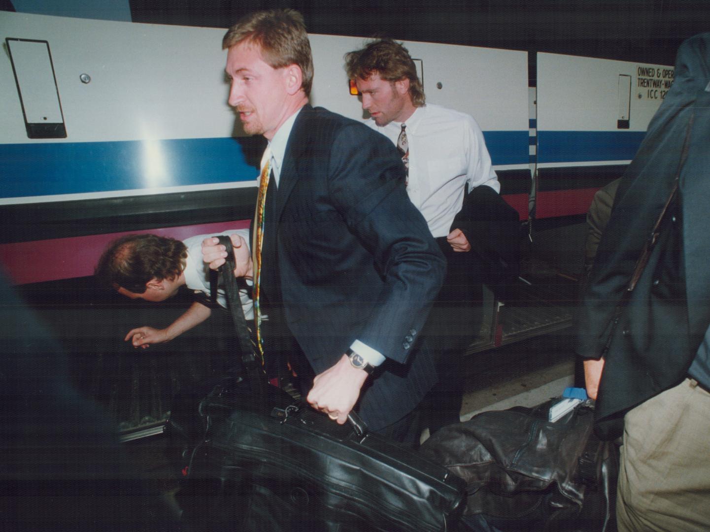Wayne Gretzky and Marty McSorley of the Kings arrive in Toronto yesterday for tonight's opening game in the Campbell Conference final