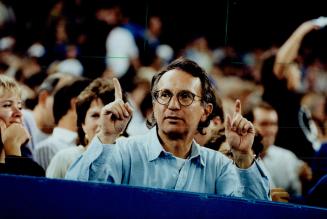 Kibitzer: Larry Grossman keeps his eye on the ball game from his SkyDome seat near visitors' dugout