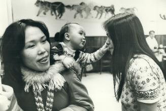Frobisher Bay: Rebecca Awaviapik with her son Carson, 8 months, and friend Suvinai Mikijuk