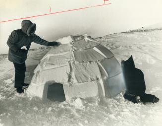Igloo he slept in is worked on by Star religion editor Tom Harpur