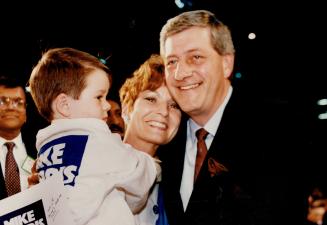 The Winner: Mike Harris embraces his wife Janet and son Mike, 5, after capturing the Ontario Tory leadership yesterday