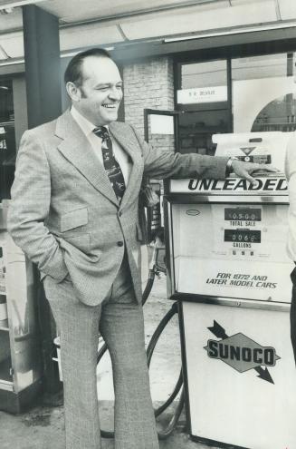 Checking where the action is, 46-year-old Ross Hennigar smiles and drapes an affectionate arm over a Sunoco gas pump in Ontario, where company sells 70 per cent of product