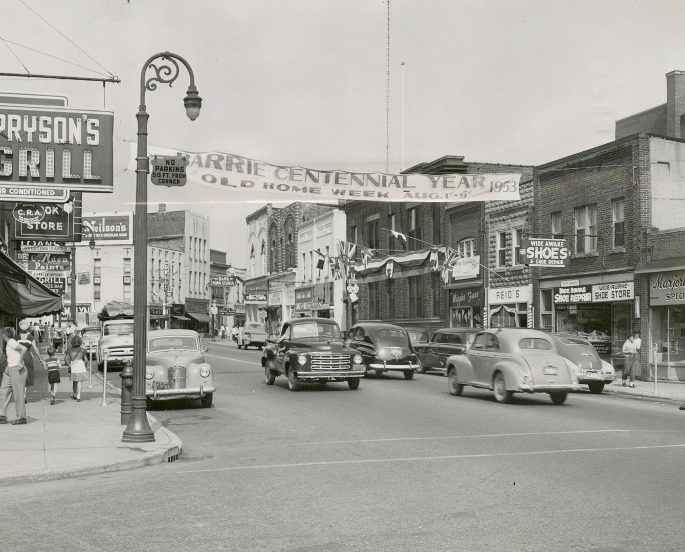 Bright colored banners stretching across main street tell of centennial celebrations