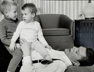 At home: Tommy Hunter relaxes with his sons Jeffrey: 3: and gregory: 1 1/2