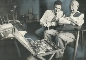 A. Y Jackson contemplates one of his latest sketches and discusses it with Mr. Robert McMichael at his home in Klein Burg