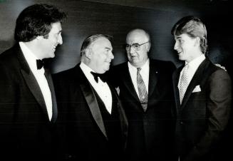 Honoring Janetta, Ex-hockey great Phil Esposito, left, and Edmonton Oilers' Wayne Gretzky, right, joined Lieutenant-Governor John Aird in honoring Lou(...)