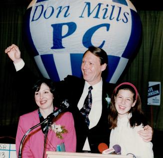 Winning smiles: Conservative candidate Dave Johnson, flanked by wife Joyce and daughter Leslie, celebrates his by-election win last night in Don Mills
