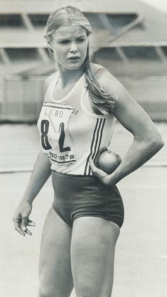 Canadian pentathlete Diane Jones cradles the shot