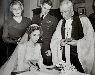 Katharine kemp is D.F.C. winner's bride. The former Katharine Edward Kemp, daughter of Lady Kemp and the late Sir Edward Kemp, is pictured signing the(...)