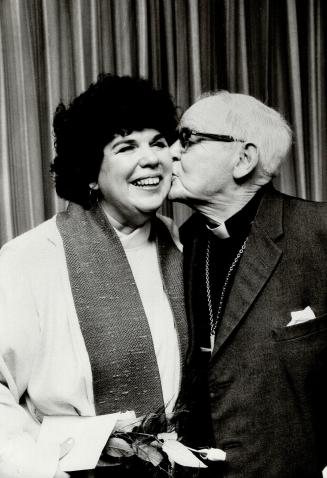 A kiss for Rev. Kilbourn from her father, Rev. Philip Sawyer