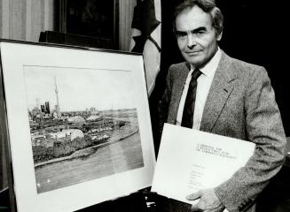 Architect and site plan: Eberhard Zeidler holds an architect's rendering and plans for the proposed domed-stadium site at Toronto's Coronation Park