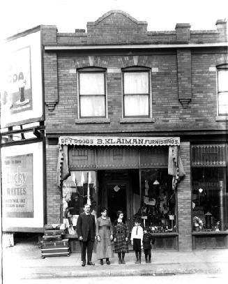 B. Klaiman Dry Goods with family in front of store