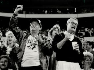 Noise from the boys: Jays fans Army Carrey, left, and Frank Bisson whoop it up at SkyDome, responding to Dave Winfield's urging for more crowd noise
