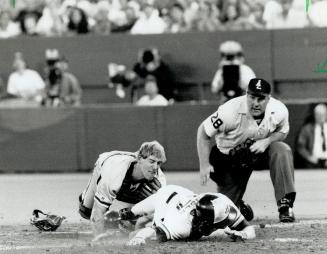 Stretch dive: Oakland's Rickey Henderson desperately reaches for
