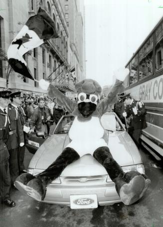 Ride on: B.J. Birdy gets a lift while celebrating on his way to the SkyDome for the big party