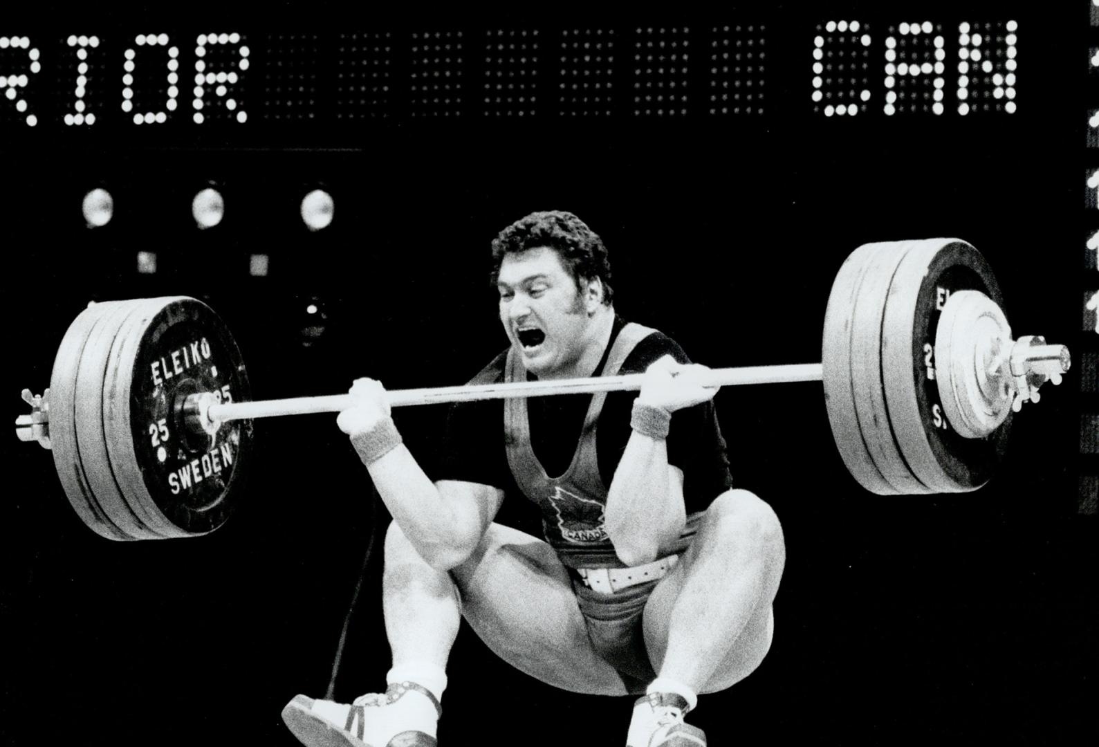 He tried hard but......Russ Prior got the Gold Medal in the IIO kg class but tried in vain to make a Commonwealth record of 205.5 kilo as he goes down with a yell
