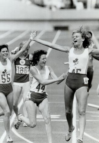 Elated. The Canadian team in the 4x400m relay shows the emotions or the games when they placed third. 55 Anne Mockie-Morelli, 44 Debbie Campbell and 4(...)
