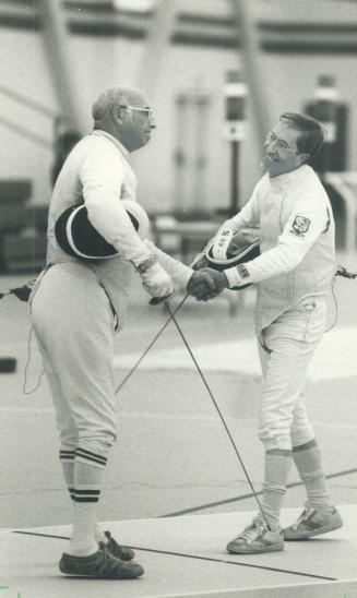 Foiled again! A hit is registered by leonard Camin under the arm of American opponent Art Plouffe during the preliminaries of the foil competition at (...)