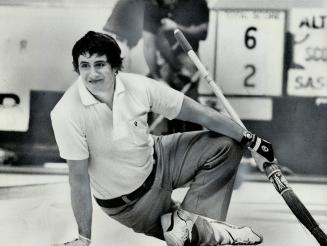 Warren Hansen who throws second rocks for Hec Gervais' Alberta rink, appears in pain as he watches shot during 8-4 win over Saskatchewan, but Hansen i(...)