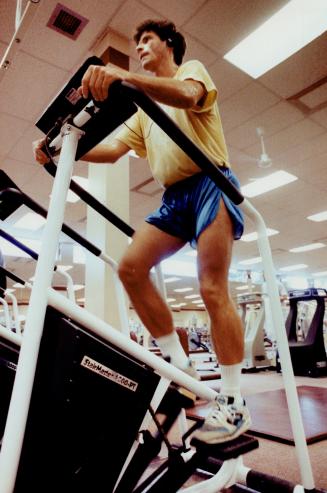 Cross training: Peter Johnson works out on a walking machine, which is a good temporary alternative to jogging, if you are having knee problems