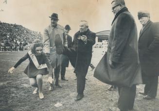 Prime Minister Pearson gets today's 39th annual Grey Cup football game underway with official kick-off