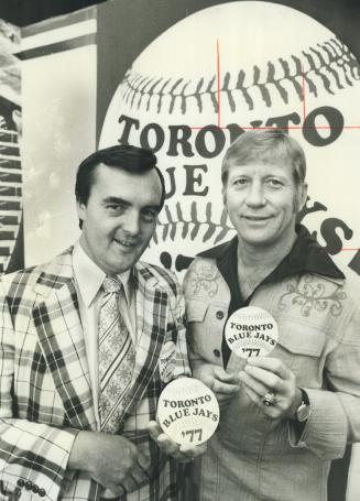 Dr. William Mills (left) of Etobicoke, winner of name-the team contest that produced name Blue Jays for Toronto's expansion baseball club, chats with (...)
