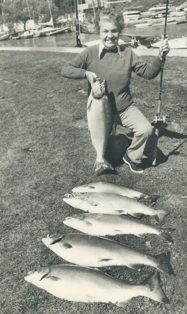 First Coho Salmon she has caught in Lake Ontario is displayed by Councillor Hazel McCallion along with catch of other members of her fishing party. Th(...)