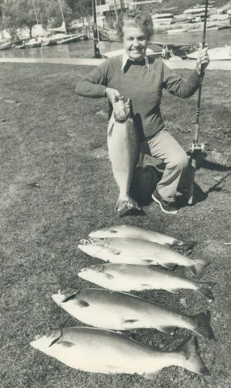 First Coho Salmon she has caught in Lake Ontario is displayed by Councillor Hazel McCallion along with catch of other members of her fishing party. Th(...)