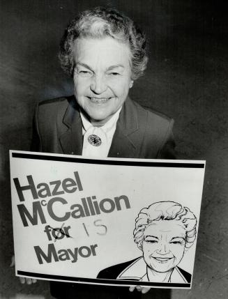 Sign of times? Mississauga Mayor Hazel McCallion holds a slightly altered campaign sign