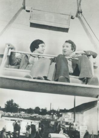 A whirl on the midway, Progressive Con Party Leader Joe Clark and his wife, Maurine - the Ferris wheel at Peterborough exhibition. Clark met party off(...)