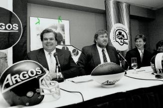New boys in town: After days of talks, Bruce McNall, left, John Candy, centre, and Wayne Gretzky confirmed this morning that they have bought the Toronto Argos football team from Harry Ornest