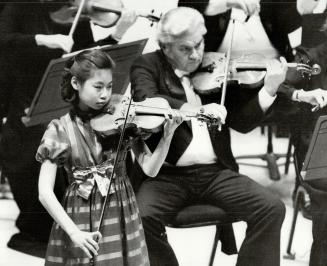 Simply astonishing: Midori, 1971-'s only 14, yet last night at Thomson Hall her violin sounded as though it was being played by a mature, name-brand artist, William Littler says