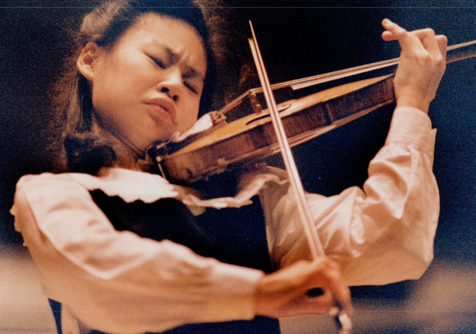 String Virtuoso. Twenty-year-old violin sensation Midori, 1971- was guest soloist at last night's Toronto Symphony Orchestra concert