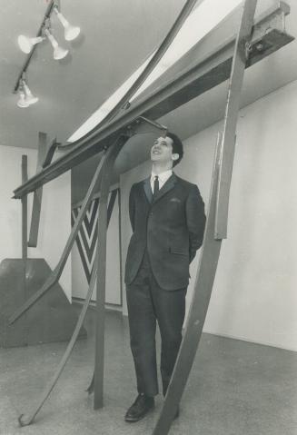 David Mirvish in his gallery. Examining a sculpture by Anthony Caro
