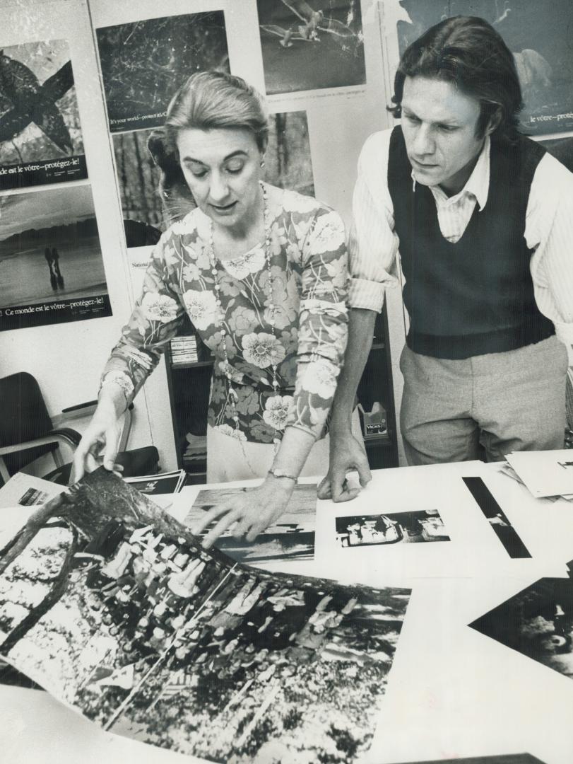 Busy in Still Photo Section of National Film Board in Ottawa, Lorraine Monk and Roman Tarnovetsky discuss layout and photo selection for book that is (...)