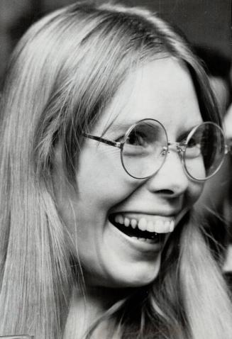 Joni Mitchell giggles before her performance at the ninth annual Mariposa Folk Festival on Centre Island last night