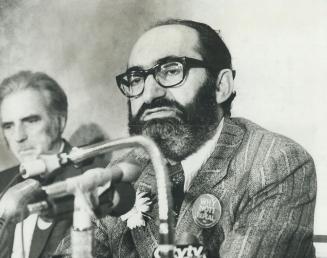 Dr. Henry Morgentaler, seated right of E. B. Ratcliffe, president of the Canadian Association for the repeal of the abortion law