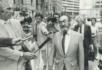Released on bail: Dr. Henry Morgentaler walks from old city hall after being released on bail yesterday. He refused to say whether his Toronto clinic (...)