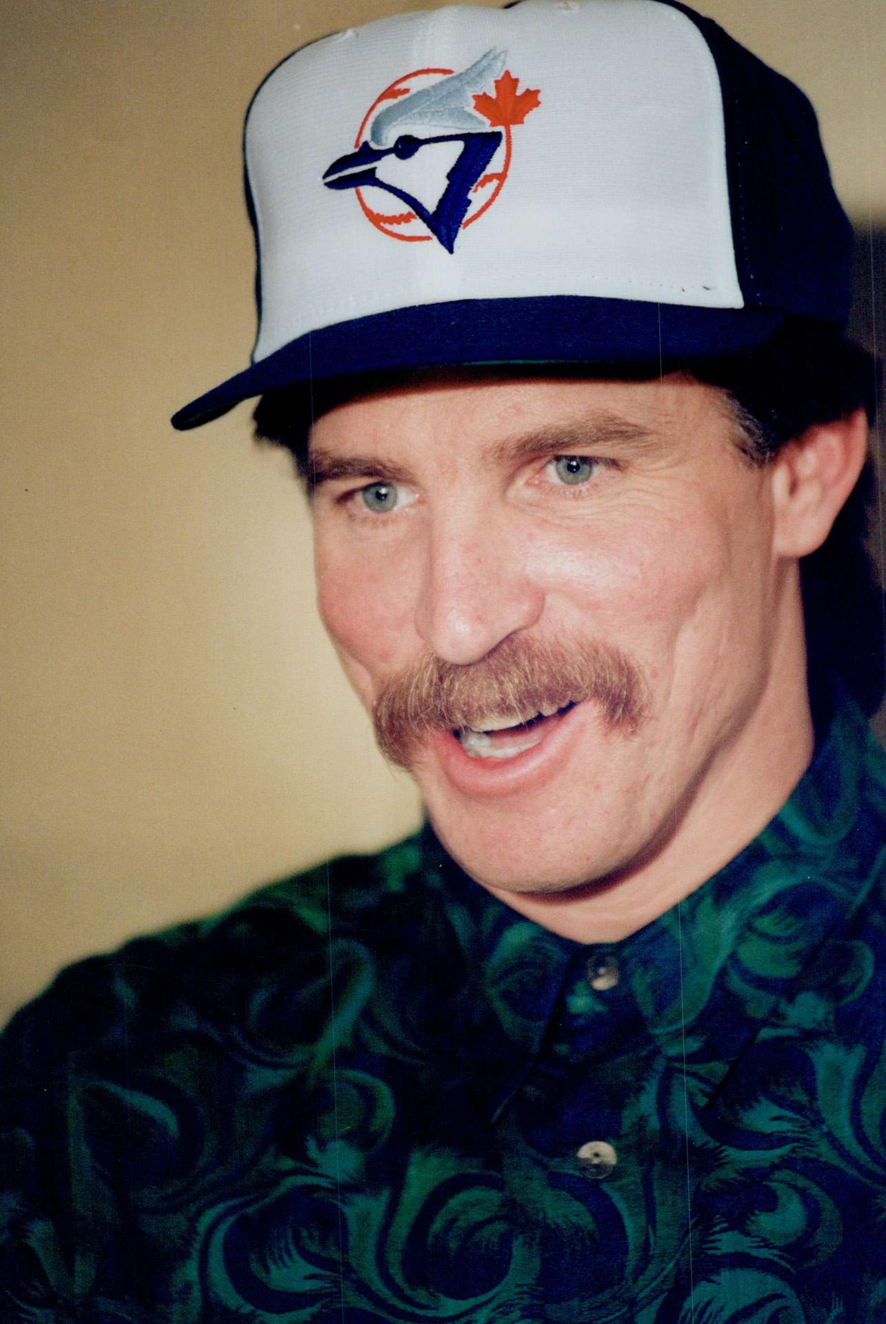 Free-agent pitcher Jack Morris tries a new hat on for size after