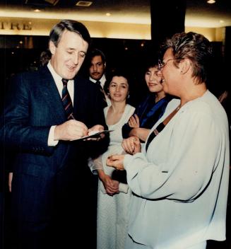 Signature session: Prime Minister Mulroney, in Toronto for tonight's gala for the Japanese prime minister, signs an autograph last night at a charity banquet sponsored by the Ukrainian community